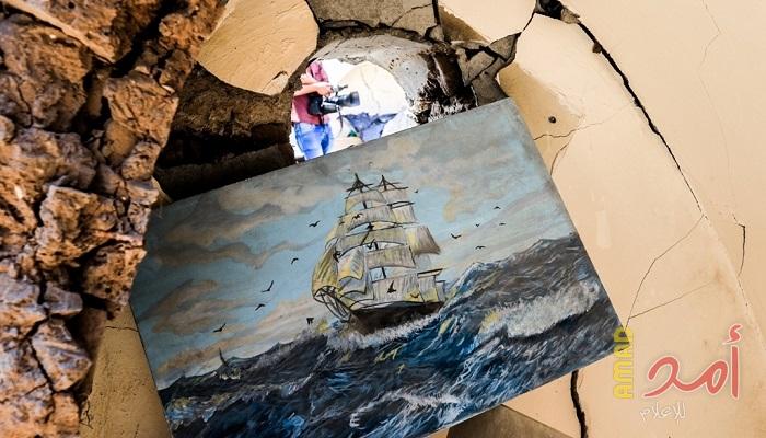 بالصور.. معرض فني ووقفة على أنقاض قرية الفنون والحرف  بغزة
