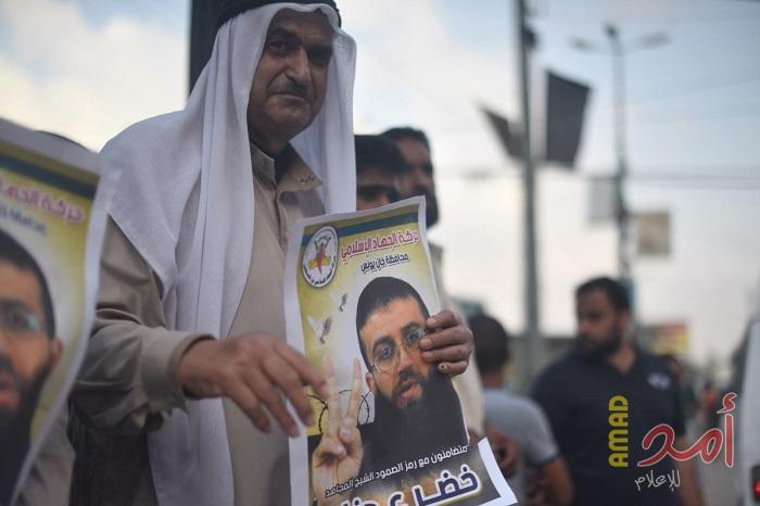 بالصور - الجهاد الإسلامي تنظم وقفة دعم وإسناد للأسير المضرب خضر عدنان بخانيونس