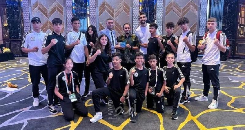 فلسطين تحصد (13) ميدالية ببطولتيّ العالم والأندية للعبة "المواي تاي" في ماليزيا